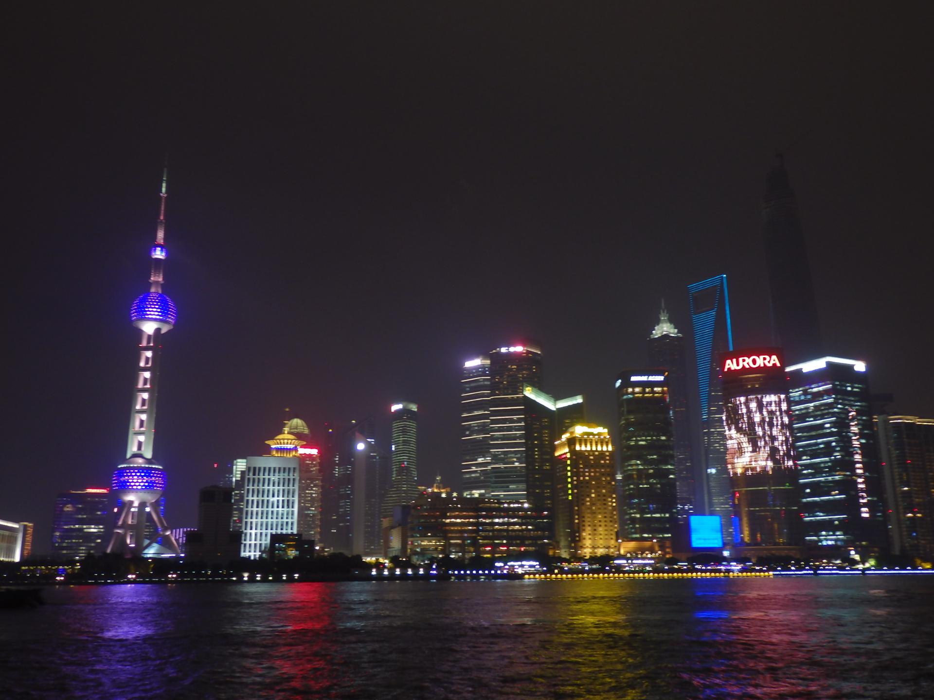 Futuristic Shanghai skyline by night.